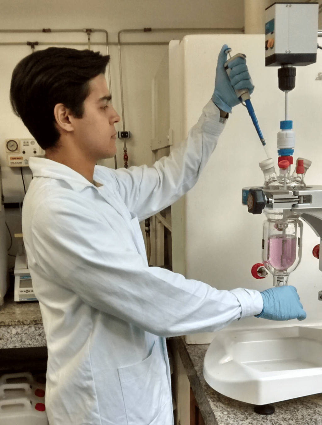 A chemist using an Orb jacketed reactor from Syrris